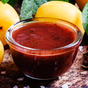 Then add the chopped tomatoes and Tkemali sauce to the soup.