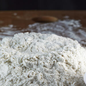 Make a recess in the flour