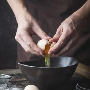 Break the egg into a bowl