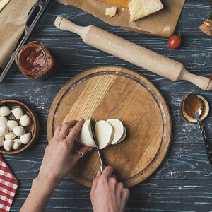 Cut the mozzarella and cherry tomatoes