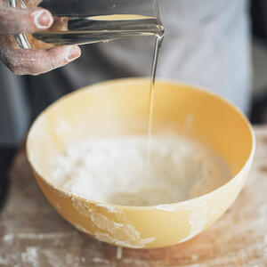 Add water to flour