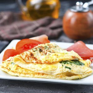 Serve the hot omelette to the table