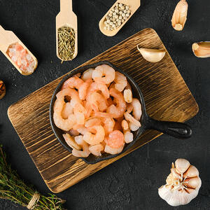 Frying shelled shrimp in a pan