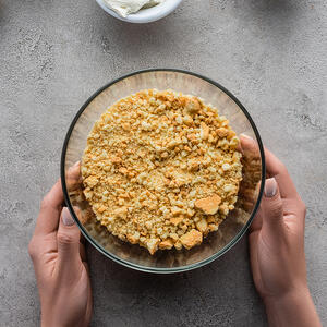 Crushing cookies into crumbs for the base