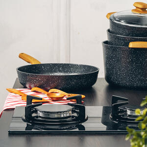 Frying onions and carrots in a pan