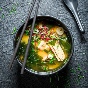 Garnish the soup with scallions