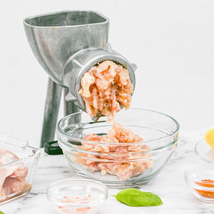 Roll chicken and shrimp through the meat grinder