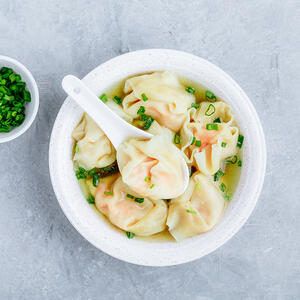 Pour broth over the wontons and garnish
