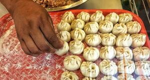 Add filling into the dough and make wonton shapes