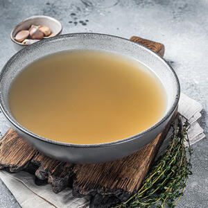 Start adding ingredients to the chicken broth