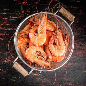 Boil and drain the cooked shrimp