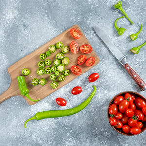 dice tomatoes and peppers