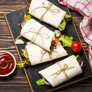 roll up the sides of the tortillas and tie with kitchen twine