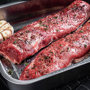 Rub the lamb fillet with the spice mix and put on a baking sheet