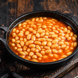 Heat the beans with juice in a pan