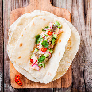 put the avocado and pepper puree on each tortilla, add some edamame beans and cabbage