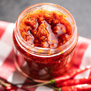 Mix the tom-yum chili paste into the broth