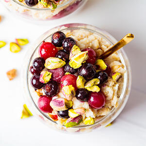 divide remaining strawberries and raspberries over overnight oats