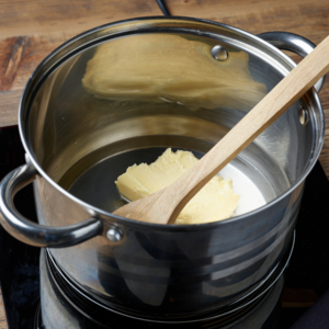 Melt the fresh cow's milk together with the butter in a saucepan 