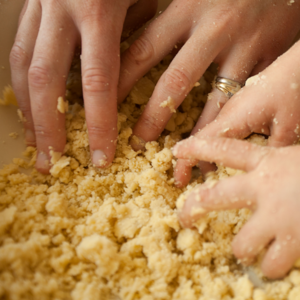 mix by hand until a sandy and slightly moist mixture is formed.