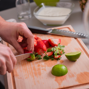 Cut 52.9 ounces of strawberries, grate the peel of a lime and squeeze the juice over it