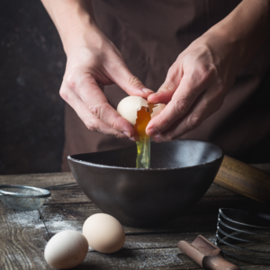 In a clear bowl, break the egg