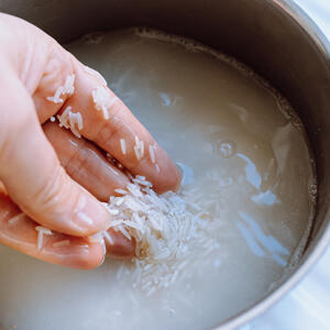 Rinse the rice, transfer in a plate to dry.