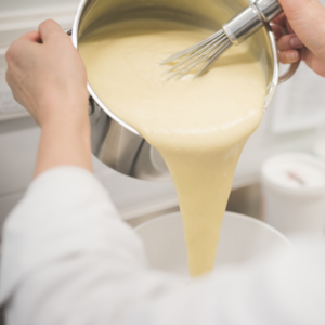 Add the mixture over the melted butter