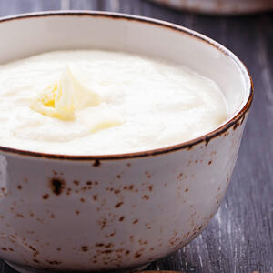 Mix spices with the eggs , milk products and semolina