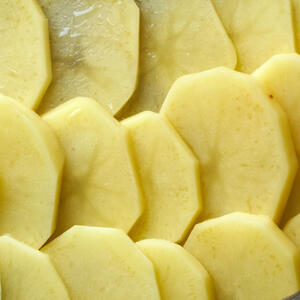 Peel and slice vegetables .Put them and meat on a oven-tray