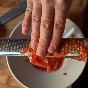 Add tomatoes to chops