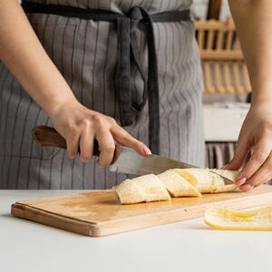 For easy blending, chop the strawberries and banana into small pieces.