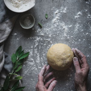 Turn the dough over on the table and knead it until it forms a ball.