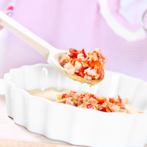 add the chopped chicken, the olives, the chopped roasted pepper, the parsley, and the grated cheese. Pour over the egg mixture.