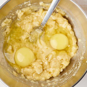 Mix mashed bananas with butter, eggs and sugar