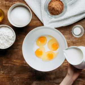 mix the flour, sugar, one egg, baking powder, vanilla essence and cold milk.