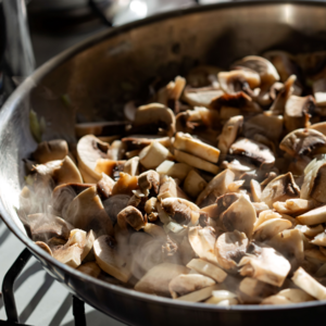 Sauté the seasoned mushrooms with a little salt and pepper in a pan over medium heat.