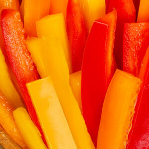 Grate radish, cut pepper into strips and combine all ingredients. Add the canned corn.