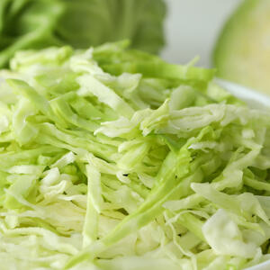 Grate carrot and cabbage