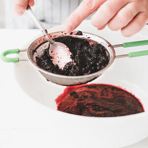 strain the berry puree through the sieve