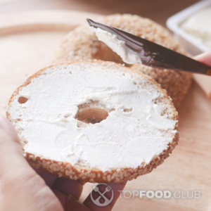 spread the cream cheese on a bagel