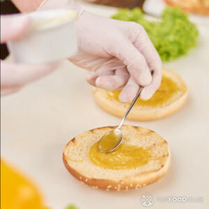 spread mustard on bun