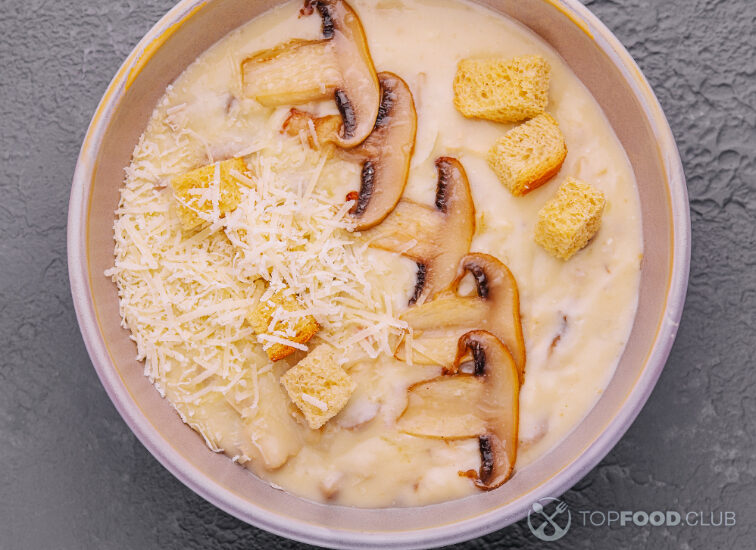 2023-04-05-6y53hf-mushroom-cream-soup-with-ingredients-on-top-view-2023-03-23-19-14-14-utc