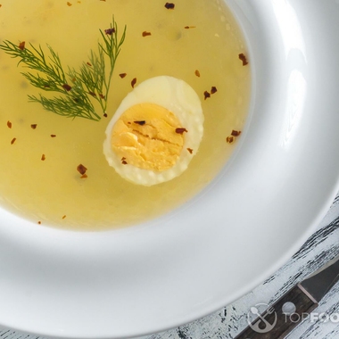 Chicken broth with rice and hard-boiled egg