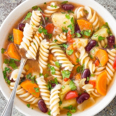 Minestrone soup with pasta and pesto